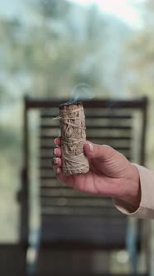 Woman Holding a Burning Sage Bundle, Close Up