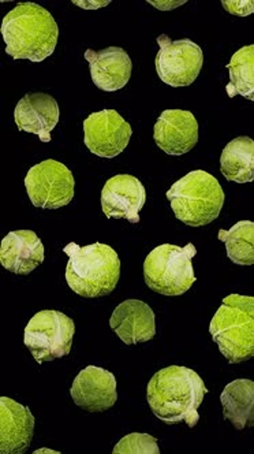 Falling Green Cabbages Vertical Seamless Loop