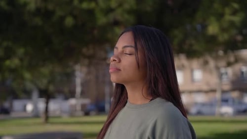 Pretty Young Woman Doing Breathing Exercises
