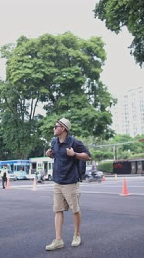 Asian Man Traveler Enjoying City View