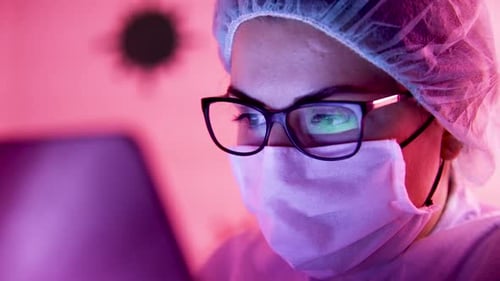 Medical Professional Using a Laptop in Hospital Setting
