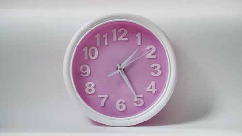 Close Up a Pink Clock Isolated on White Background