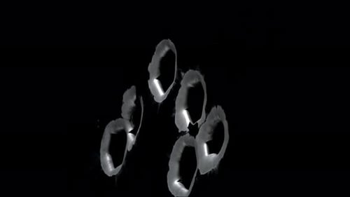 Impact Collection: Side angle view of six big gunshot fired on black metal
