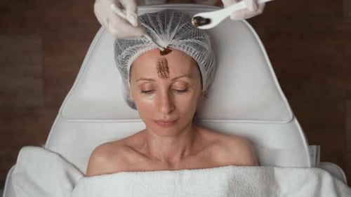 Woman Getting Beauty Treatment at Cosmetic Clinic