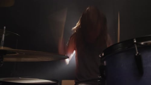 Man Playing Drums in Heavy Metal Rock Band,