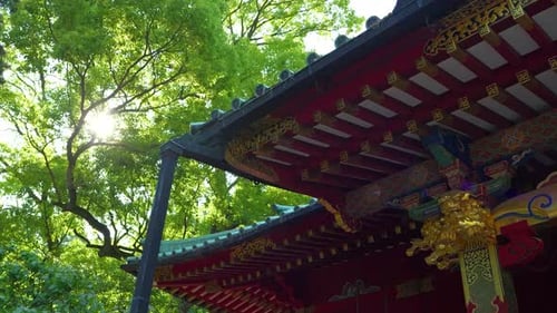 Beautiful traditional wooden Japanese temple with sunflares