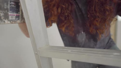 Man Climbing Aluminum Ladder Close Up