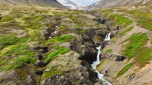 Waterfall in Highlands Mountain River Inside the Canyon Magical Scenic Aerial Drone Shot Iceland at