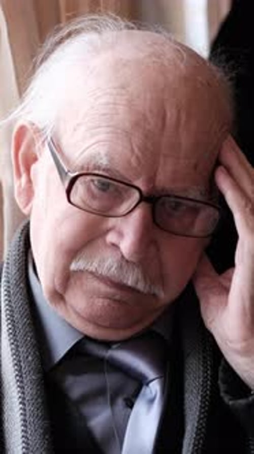 A Selfabsorbed and Contemplative Elderly Man Depicted in a Pensive Pose and Manner