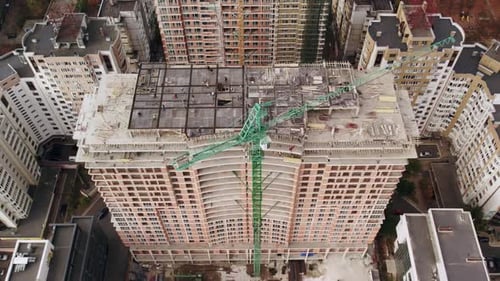 Aerial View of Urban Tower Block Under Construction in City Skyline