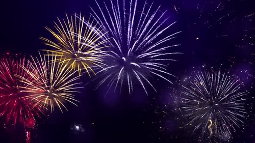 Colorful Fireworks Explosions Against Dark Night Sky Background