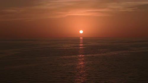 Burning Sky and Shining Golden Waves Ocean Beach Sunsets Aerial Shot