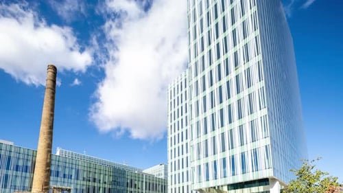 Office Building in Barcelona with Passing Clouds