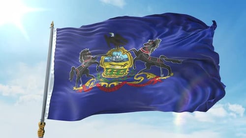 Realistic Waving Pennsylvania State Flag Against Blue Sky