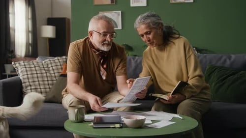 Senior Couple Reviewing Documents Together at Home