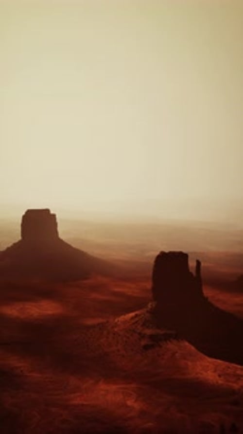 Vast Desert Landscape With Distant Rocks