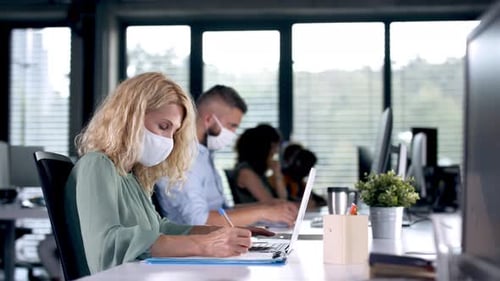 Business People with Face Masks Indoors in Office, Coronavirus Concept