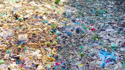 Big plastic problem pollution on a toxic river of Bangladesh. Tilt down
