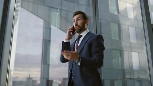 Company Manager Shouting On The Phone Standing Office Suffering From A Headache Close-Up. Angry D...