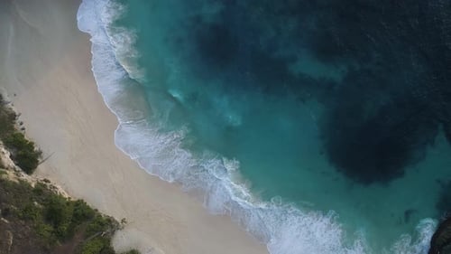 Beautiful Tropical Beach Aerial - Bird's Eye view of Ocean Waves Crashing on Empty Beach from Above