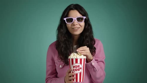 The Beautiful Girl with Popcorn in Her Hands and 3D Glasses
