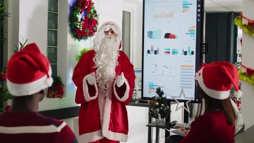 Santa Giving Presentation in Office Decorated for Christmas