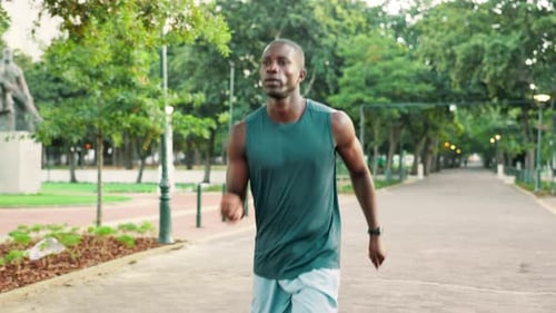 Black man, running and fitness at park, outdoor or training for health, challenge