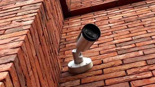 Surveillance at the Mall CCTV Camera on Building Wall