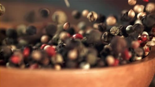 A Plate with Peppercorn Falls on the Table Filmed on a Highspeed Camera at 1000 Fps