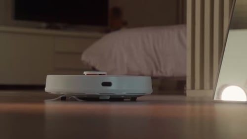 Robot Vacuum Cleans Floor in Home Interior
