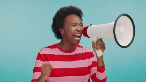 Protest, megaphone and black woman in studio for motivation, speech and announcement