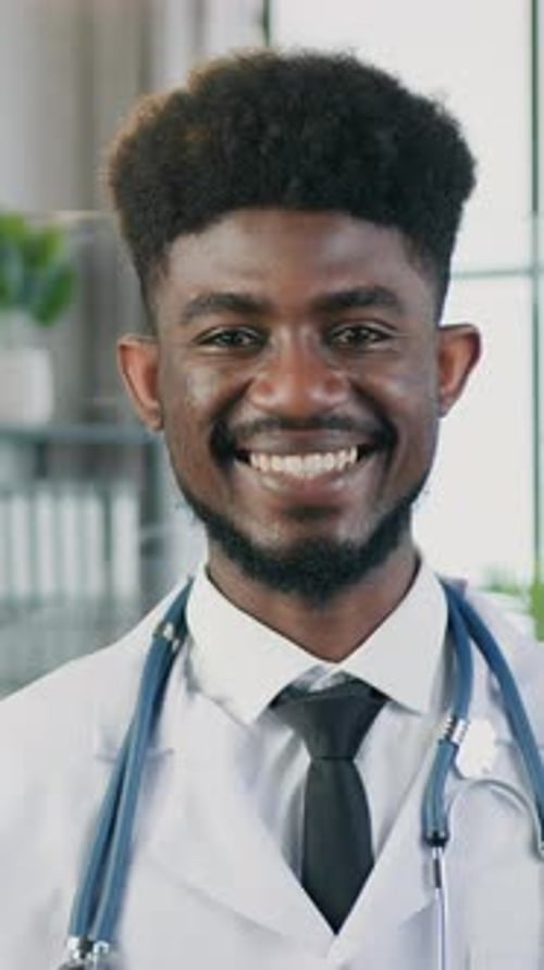 Smiling Young Adult Doctor with Stethoscope Portrait