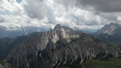 Aerial video flying forward over the Dolomites, Northern Italy during a sunny day