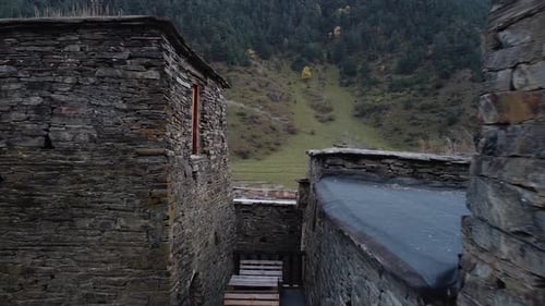 Drone flies between two walls of an old castle