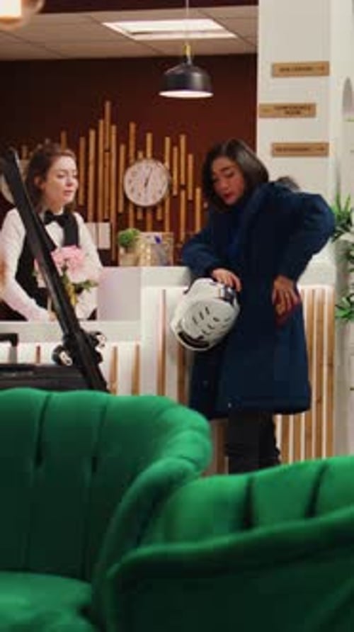 Hotel Staff Assist Guests at the Reception Desk