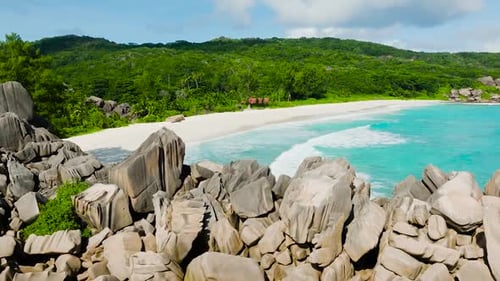 Granite Rocks Overlooking a White Sandy Beach and Turquoise Sea