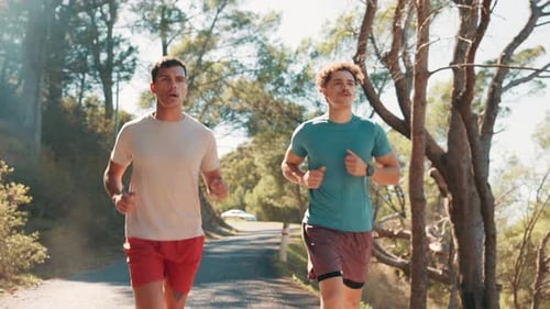 Men, running and partner at park, training and path in nature, fitness and workout for wellness