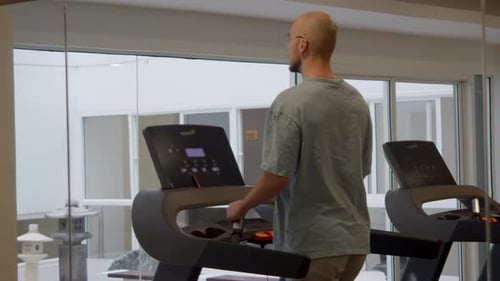 Cardio Training and Healthy Lifestyle Concept with Fitness Equipment Row Calm Indoor Lighting and