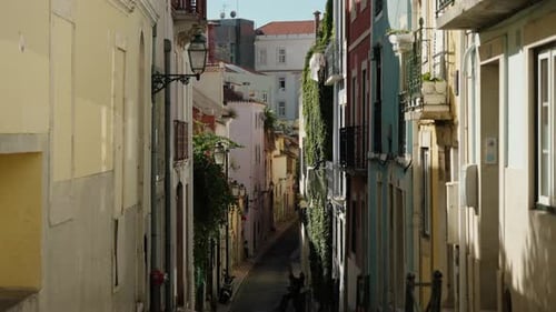 Typical Alleyway In The Old Town Streets In Lisbon, Portugal. Tilt-up Shot