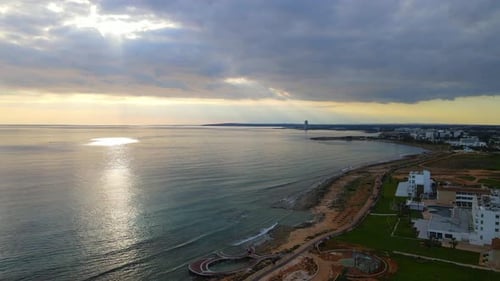 Beautiful sunset over the sea in the city.