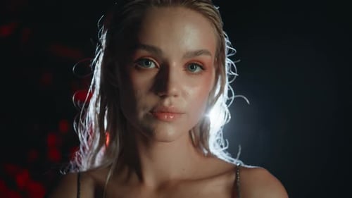 Woman with Wet Hair and Dewy Makeup Posing