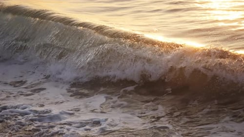 Sea Waves on Sunset Ocean Beach with the Sun Capture the Beauty of a Tranquil Golden Hour Ocean Wave
