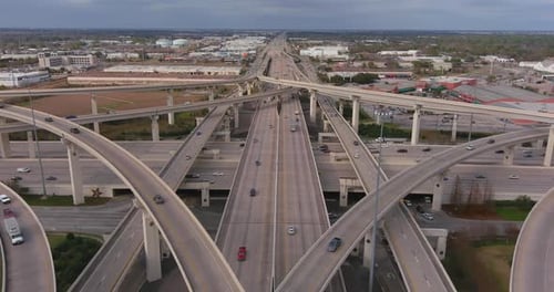 Dramatic Aerial Perspective of Complex Highway Interchange and City Traffic