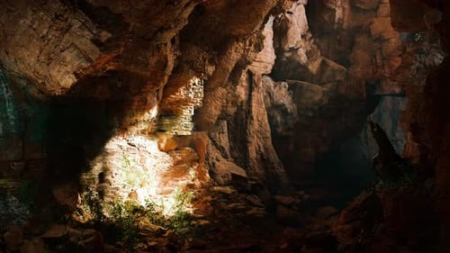 A Mysterious Cave Illuminated By a Beam of Light