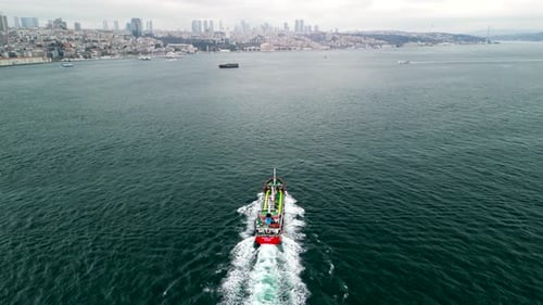 Istanbul/Turkey circa 2023: Follow shot of ship moving in the Bosphorus strait