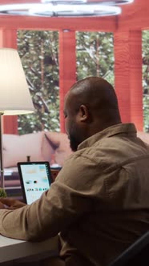 Vertical Video Business Manager Writing Notes to Create a New Investment Strategy