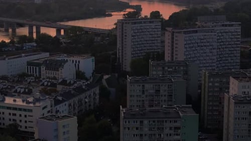 Aerial View of the Sun Rising Over Warsaw Poland The Vistula River Reflects the Colorful Red Sky As