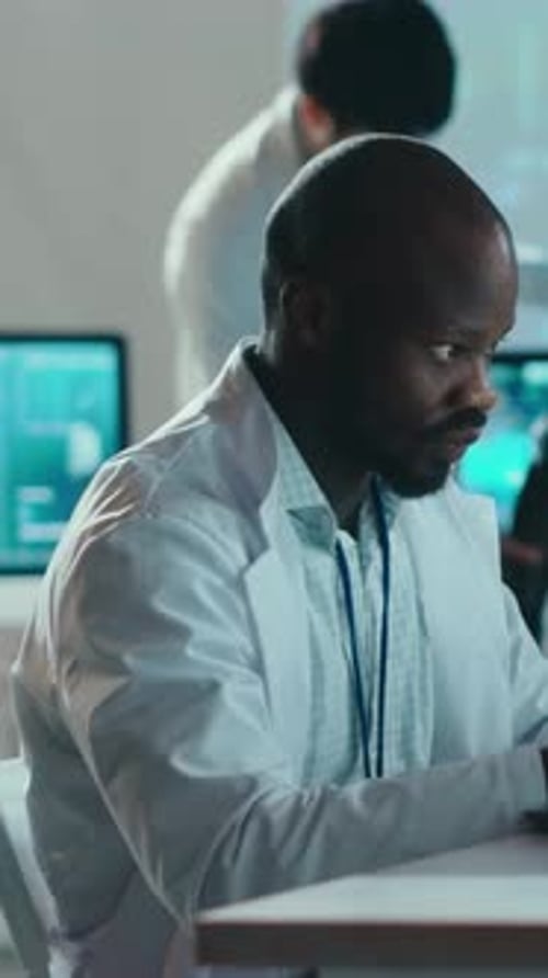 A Scientist is Meticulously Analyzing Complex Data Within a Hightech Laboratory Environment