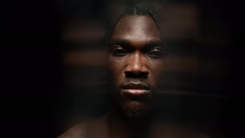 Close Up of Young Man Opening Eyes