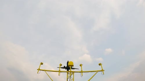 Aircraft landing approach over airport runway with guidance lights